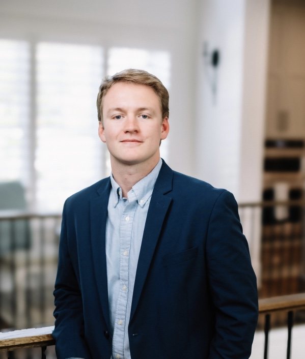 Dilon Farmer, REALTOR®, in a navy blazer